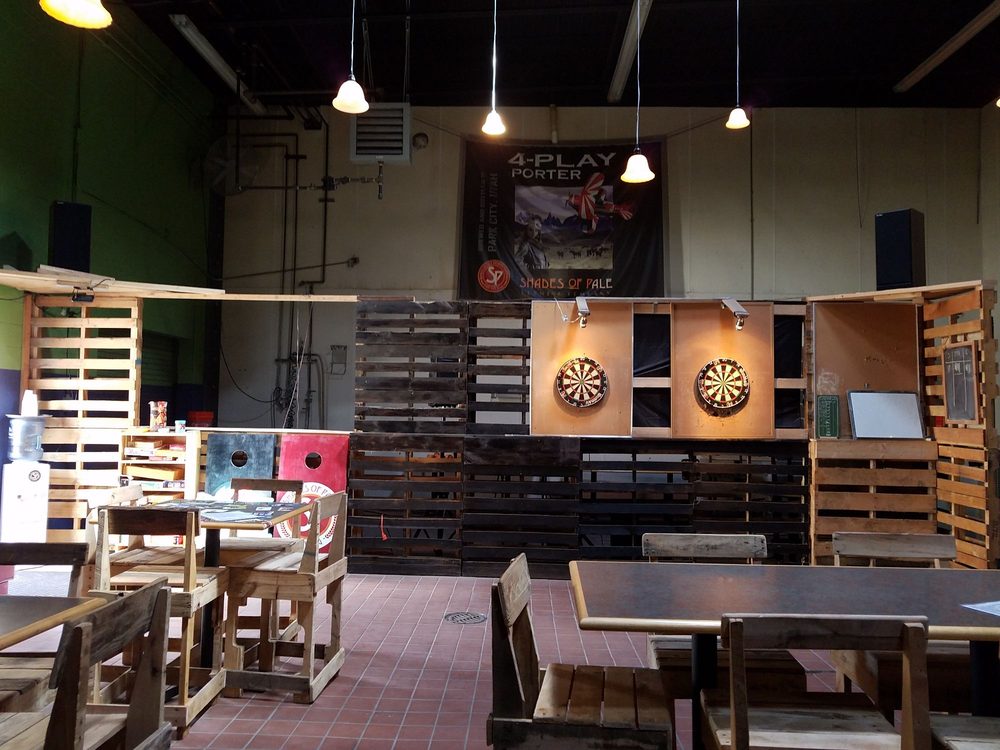 Dart boards and cornhole boards at Shades of Pale Brewing