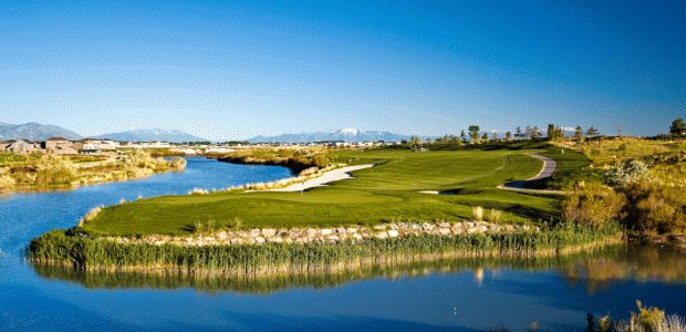 Beautiful shot of a Par-3 over the Jordan River at Thanksgiving Point Golf Course in Lehi, Utah