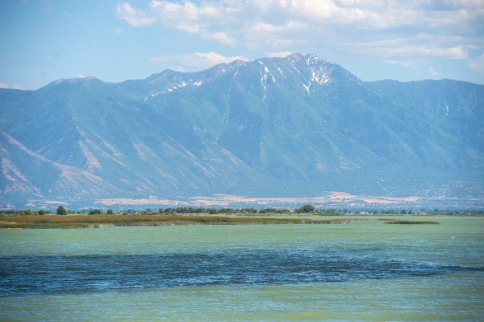 Utah Lake's waters vary from a turquoise - green to a deep blue depending where you are on the lake