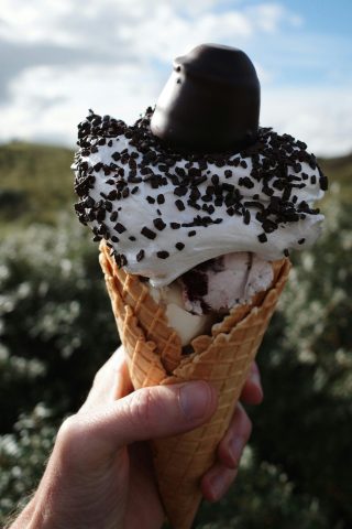 Ice cream in a waffle cone with sprinkles and chocolate toppings in Salt Lake City