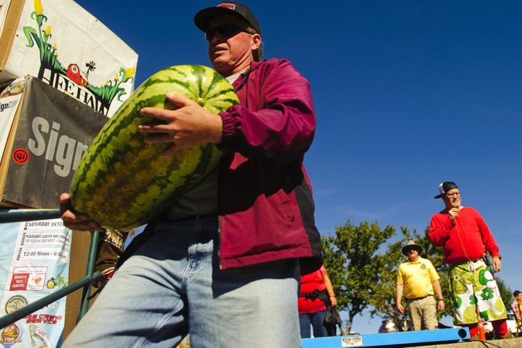 Man carrying large watermelon at the Thanksgiving Point Harvest Festival