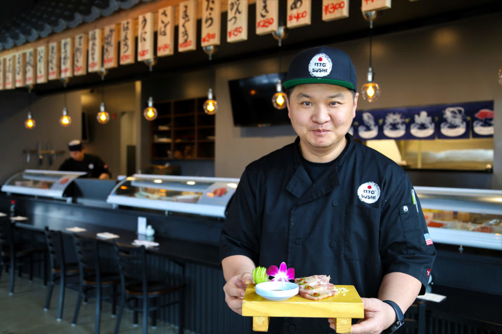 Chef Itto at Itto Sushi featuring a sashimi platter