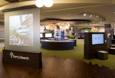 The interior of the family search library. Larger interactive touchscreen displays in a main area.