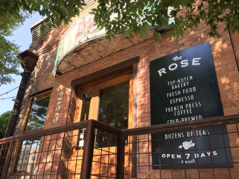 The Rose Establishment Exterior with a black and white printed sign "Top Notch Bakery, Fresh Food, Expresso, Open 7 Days a week"