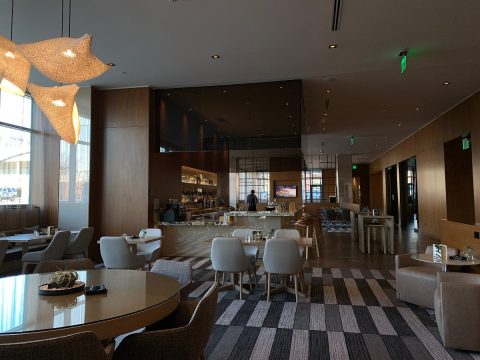 AC Hotel Salt Lake City Downtown lobby with modern seating and bar area, a stylish option for business travelers searching Salt Lake City hotels