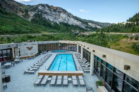 Cliff Lodge at Snowbird outdoor pool with mountain views near Little Cottonwood Canyon, Utah
